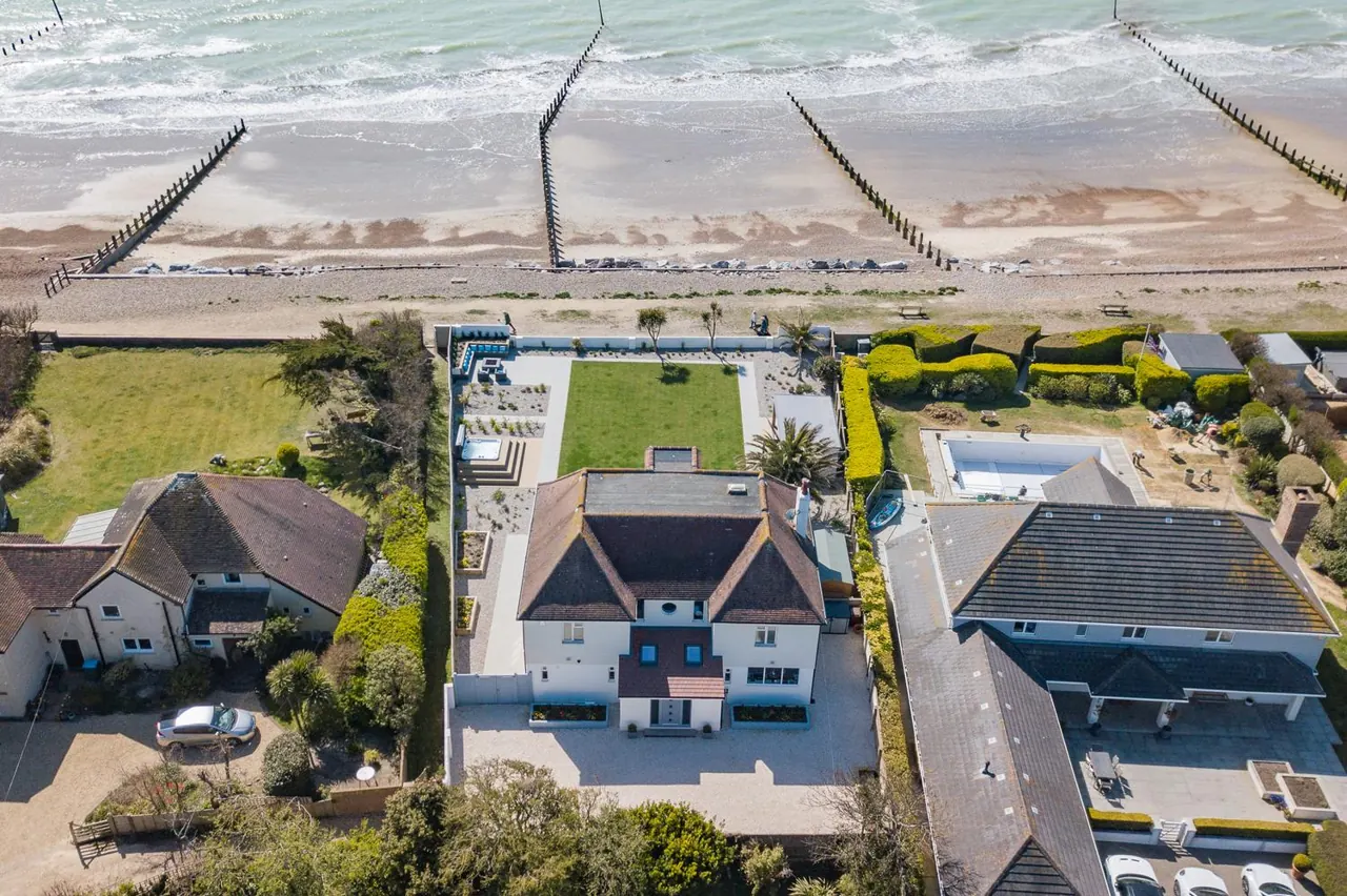 Sun Beach House from the air, with the beach and sea beyond